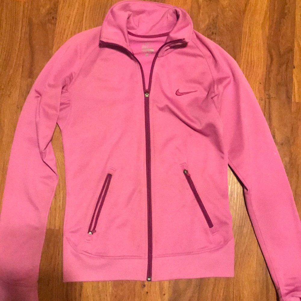 Pink nike jacket , no tears , no stains .